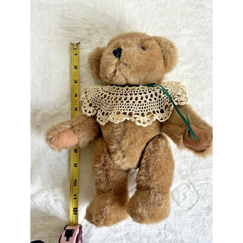 Vintage stuffed brown and tan teddy bear with crochet shawl